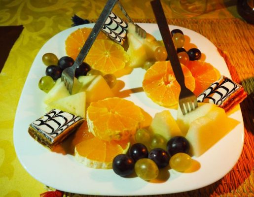 Dessert of fresh fruit and pastries