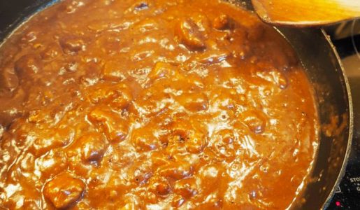 Stock and wine added to the kidneys in the pan